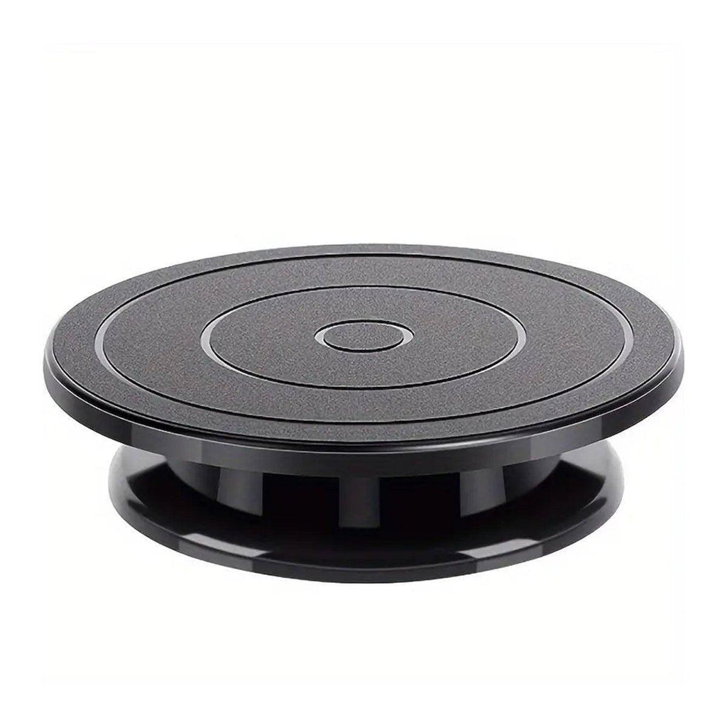 Rotating Cake Turntable Stand Black Plastic, showing a cake decorated with berries on a black plastic turntable.