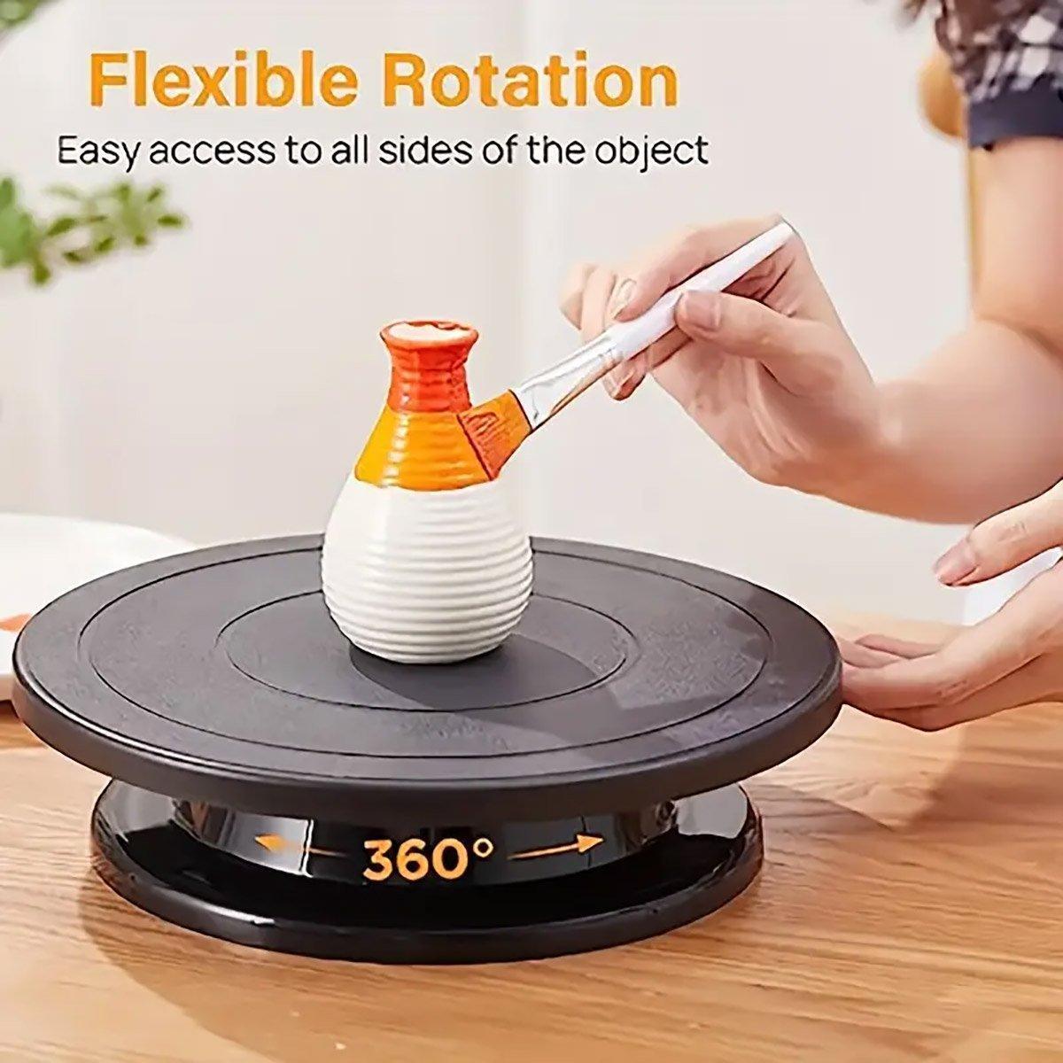 Rotating Cake Turntable Stand Black Plastic, showing a cake decorated with berries on a black plastic turntable.